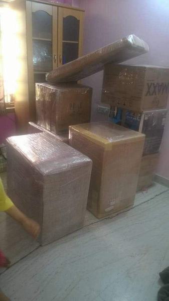 Tall furniture wrapped for transit – packers and movers in Lucknow